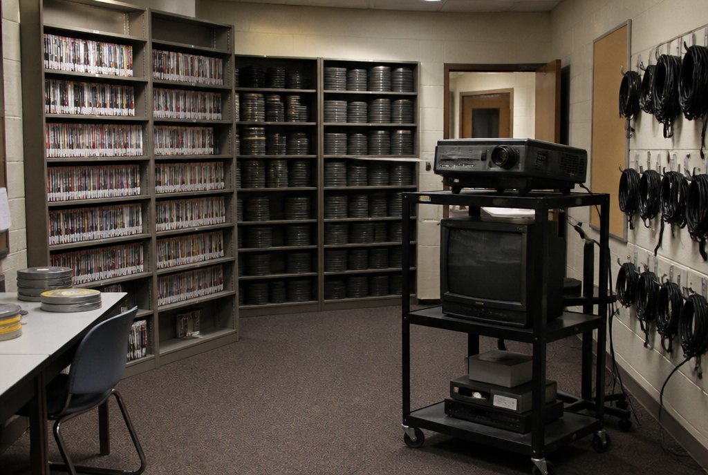 A media room with shelves of recordings